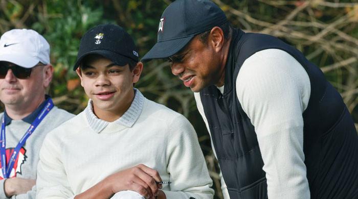 Tiger Woods without limp as he joins son Charlie at golf championship