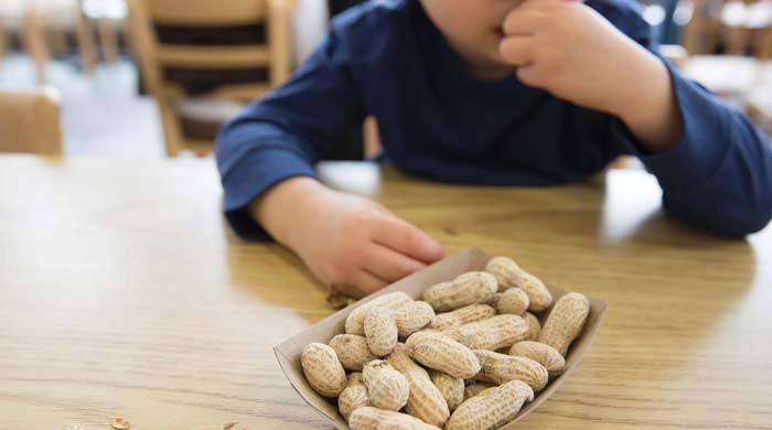 How can parents protect their children from peanut allergies?